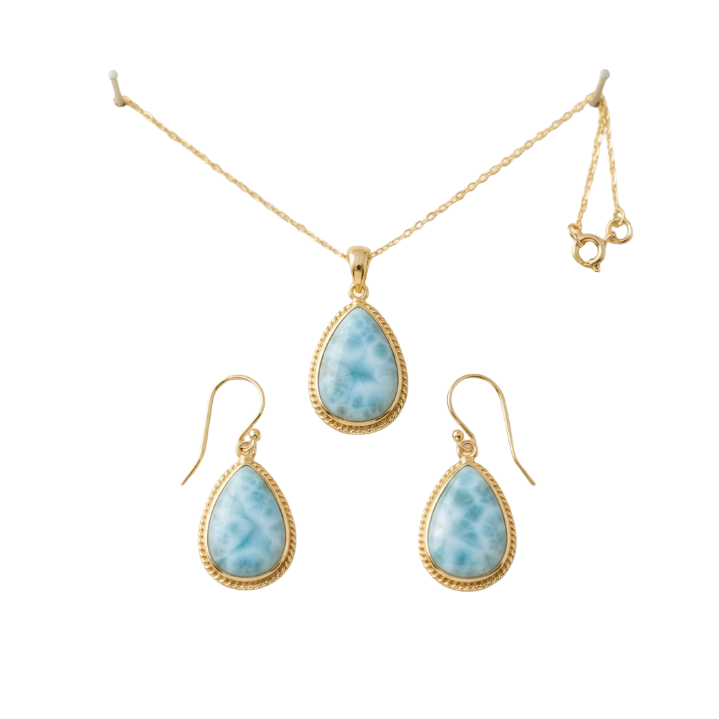 Gold-toned teardrop-shaped Larimar stone pendant necklace with matching earrings on black background