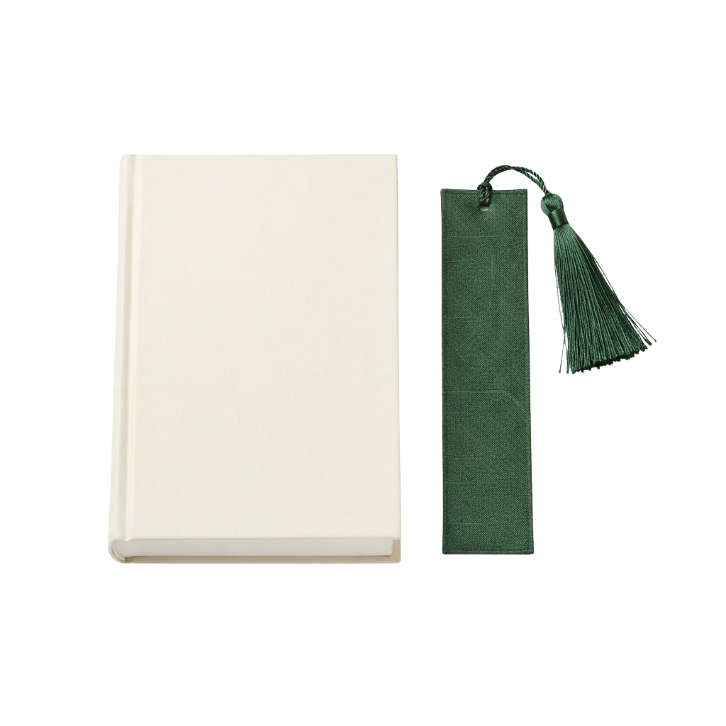 A plain white book next to a green bookmark with a decorative tassel attached by a string loop