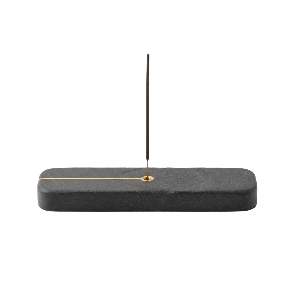 A thin needle securely held upright in a gray rectangular stand