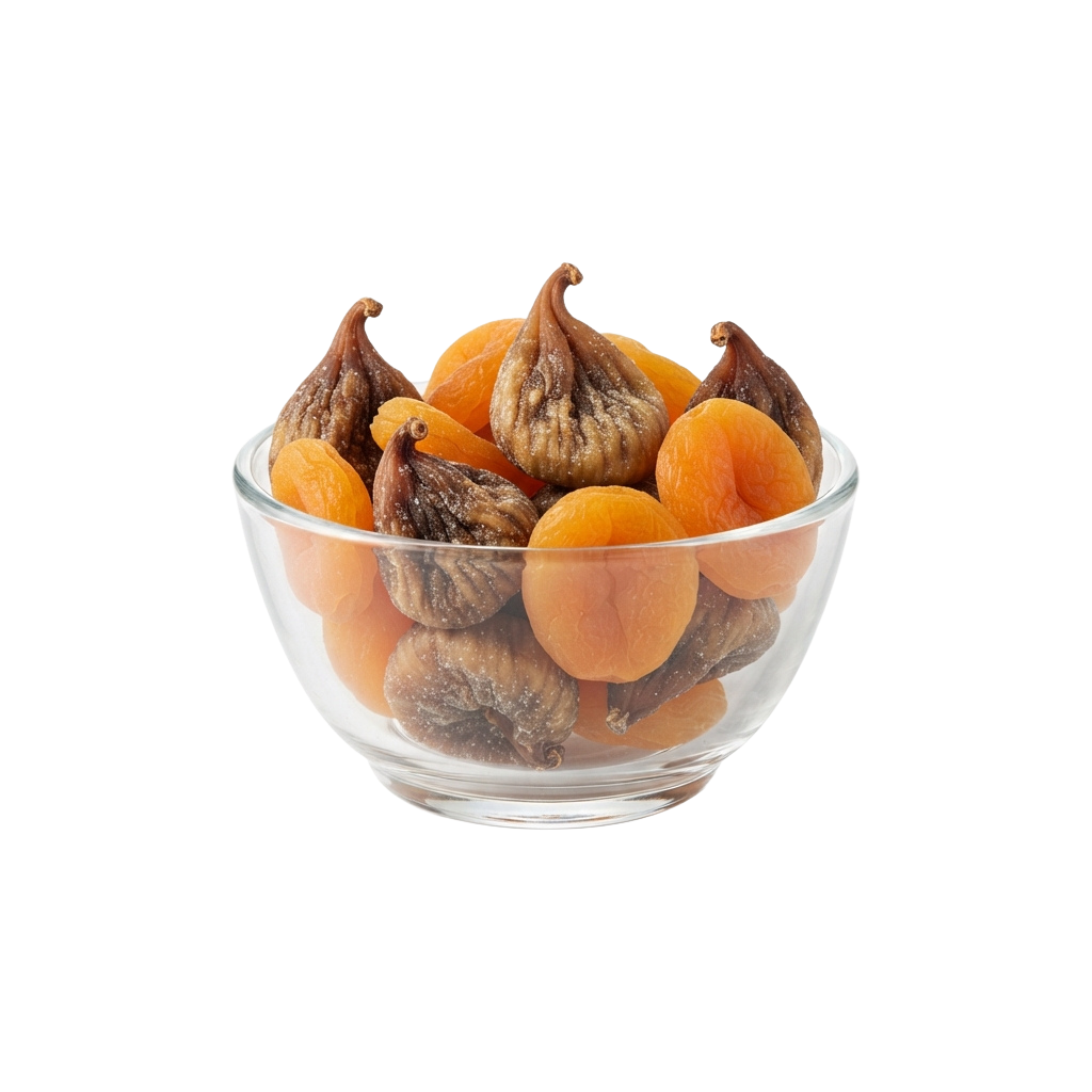 Glass bowl filled with dried figs and apricots on a black background