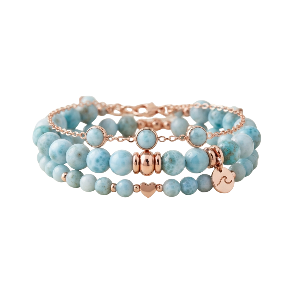 A rose gold bracelet with turquoise beads and decorative charms including a heart and wave design
