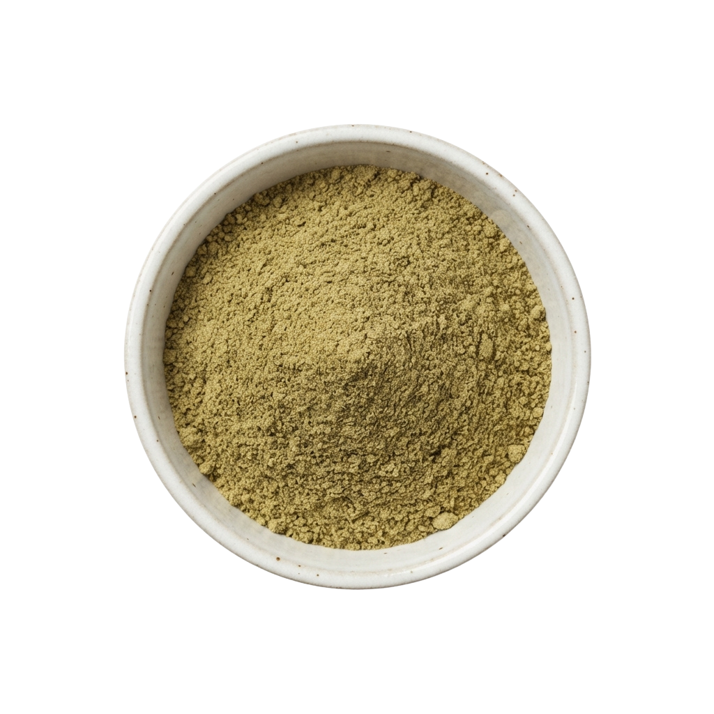 A white bowl filled with finely ground green powder, possibly an herb or spice.