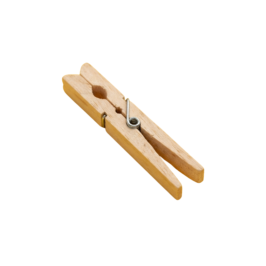 A single wooden clothespin with a metal spring clip shown against a dark background