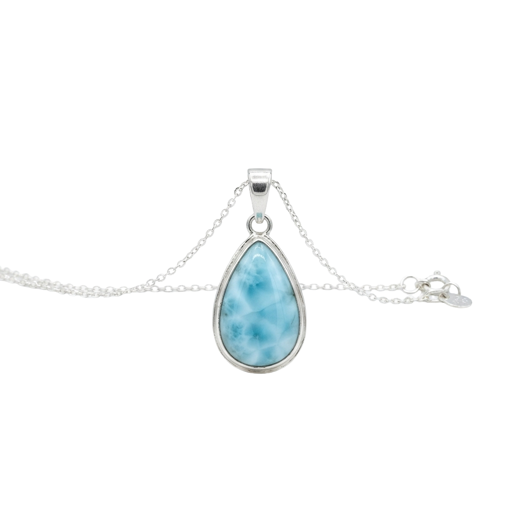 A silver pendant necklace featuring a teardrop-shaped blue larimar stone set in a silver frame