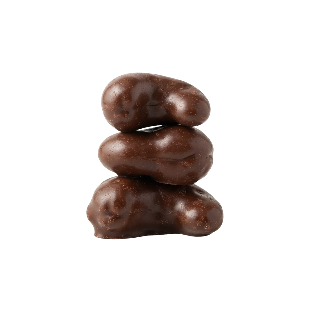 Three stacked chocolate truffles with a glossy, dark brown finish against a black background