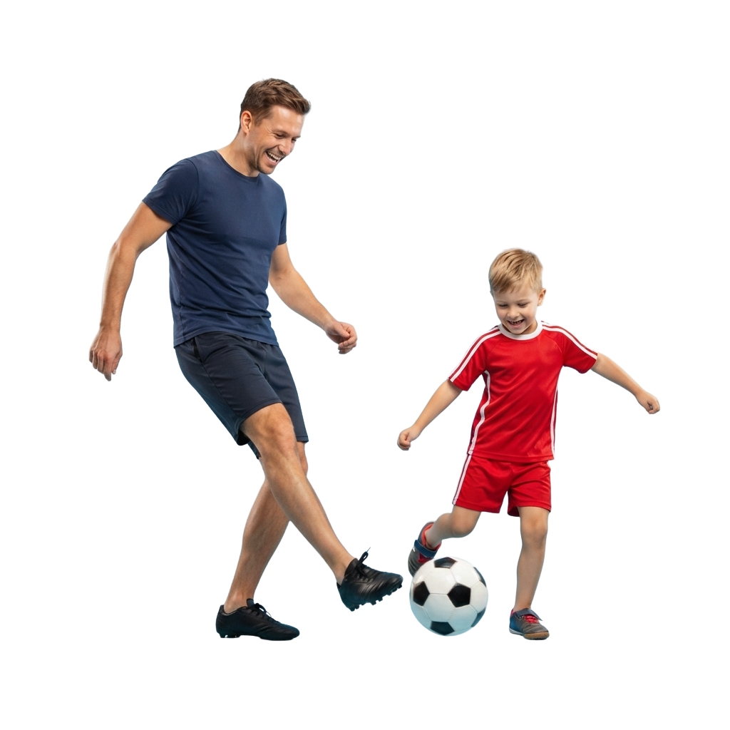 An adult and a child playing soccer together, both smiling and focusing on a ball.