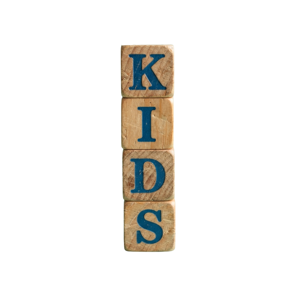 Stacked wooden blocks spelling K-I-D-S against a black background
