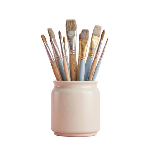 Nine paintbrushes with wooden and synthetic handles in a light pink ceramic holder