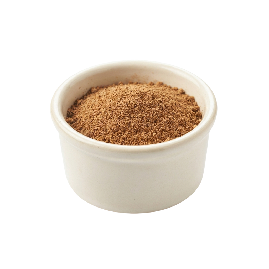 White bowl filled with finely ground brown spice