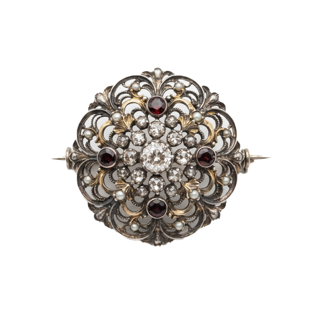 Intricate vintage brooch featuring gemstones and pearls in an ornate silver design