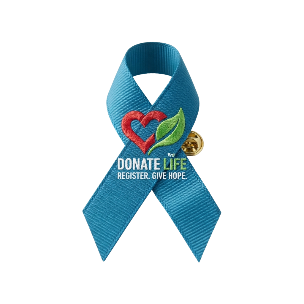 Blue ribbon with red heart and green leaf emblem promoting organ donation, labeled Donate Life Register Give Hope