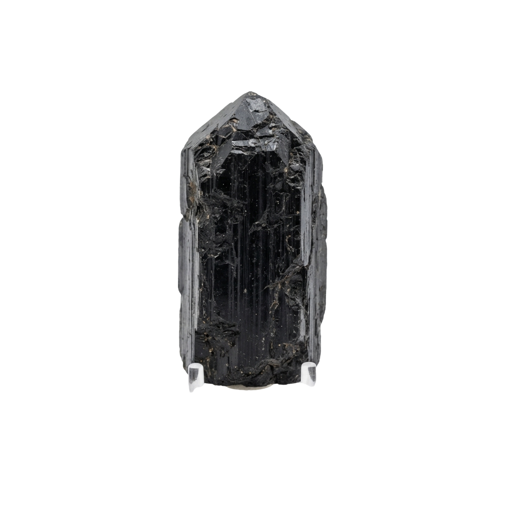 A tall, dark, elongated tourmaline crystal with a rough, natural surface and pointed ends.