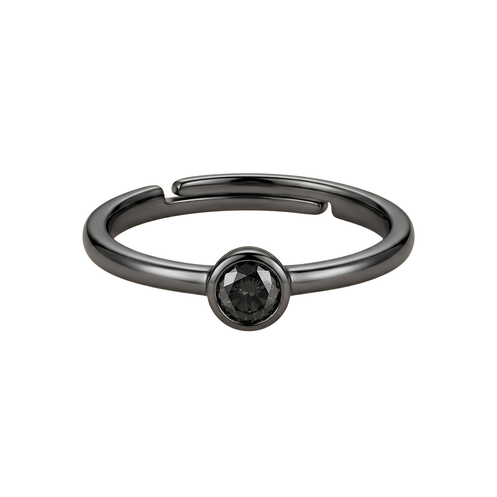 A thin silver ring with a small black gemstone in the center, set against a dark background