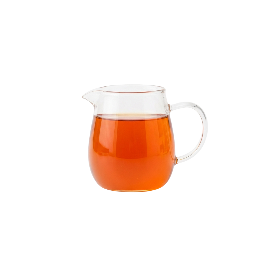 A transparent glass teapot filled with amber-colored liquid against a black background