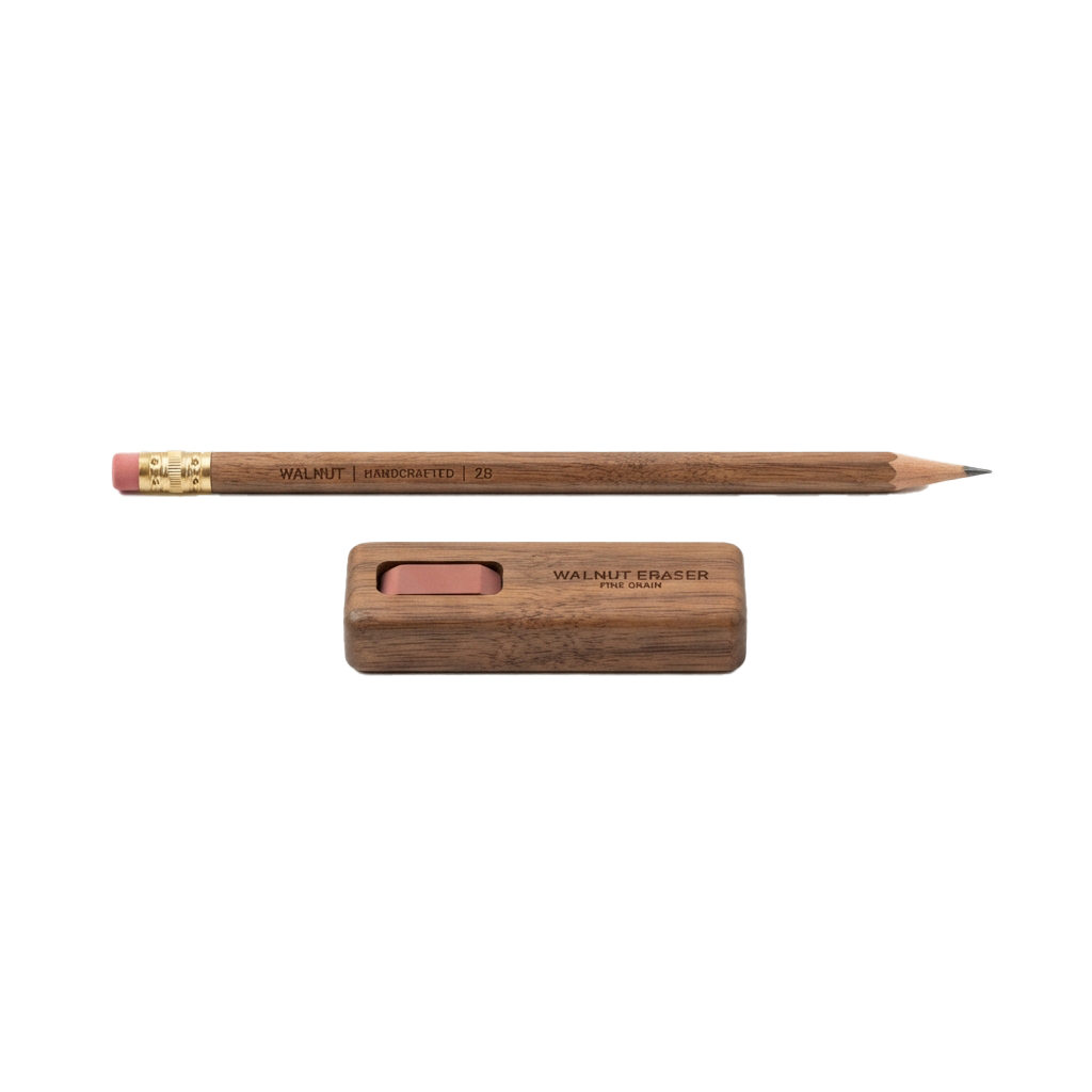 A handcrafted walnut wood pencil with a gold ferrule and matching walnut eraser in a wooden case