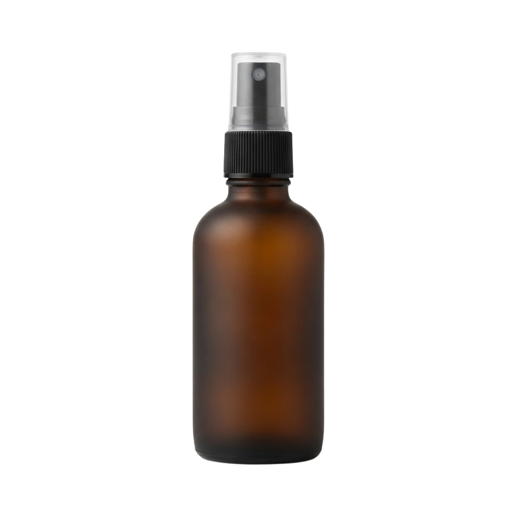 Amber glass spray bottle with black pump top against a dark background