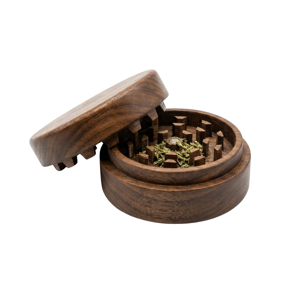 Open wooden herb grinder with a small amount of green plant material inside