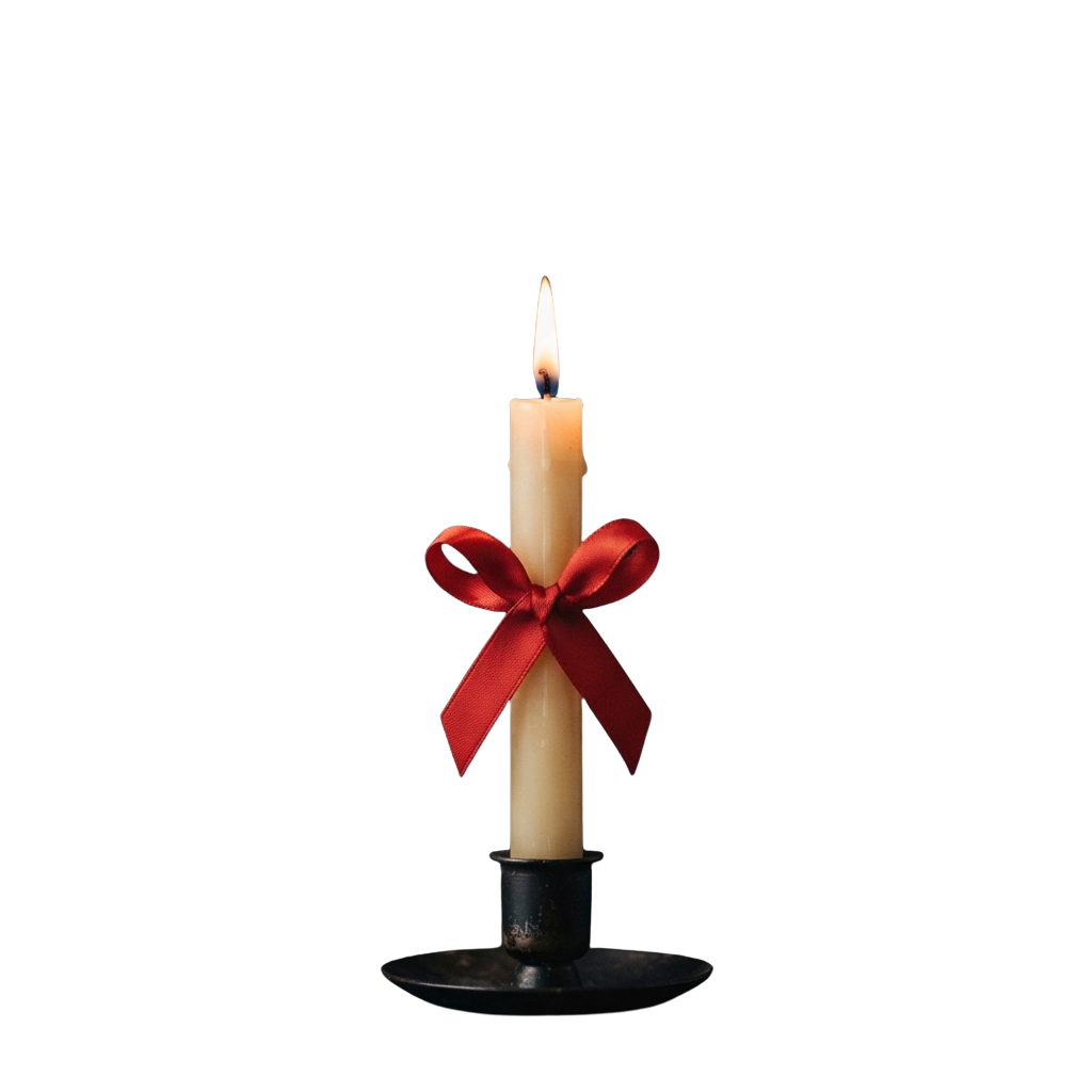 A lit candle with a red velvet bow tied around the middle on a black holder against a dark background