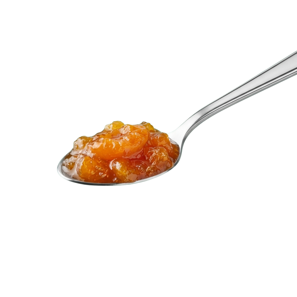 A silver spoon holding a thick, orange tomato-based spread with small chunks.