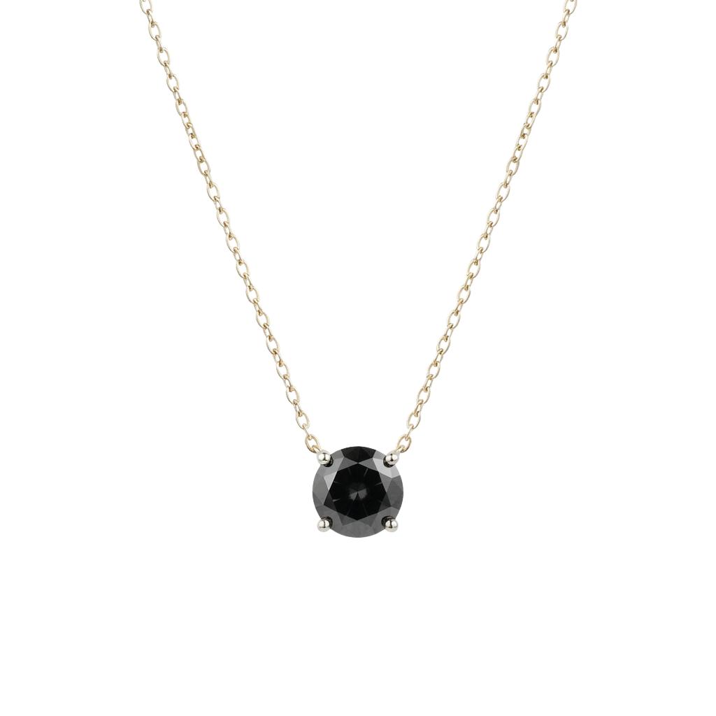 A silver chain necklace with a black gemstone pendant set in a prong setting