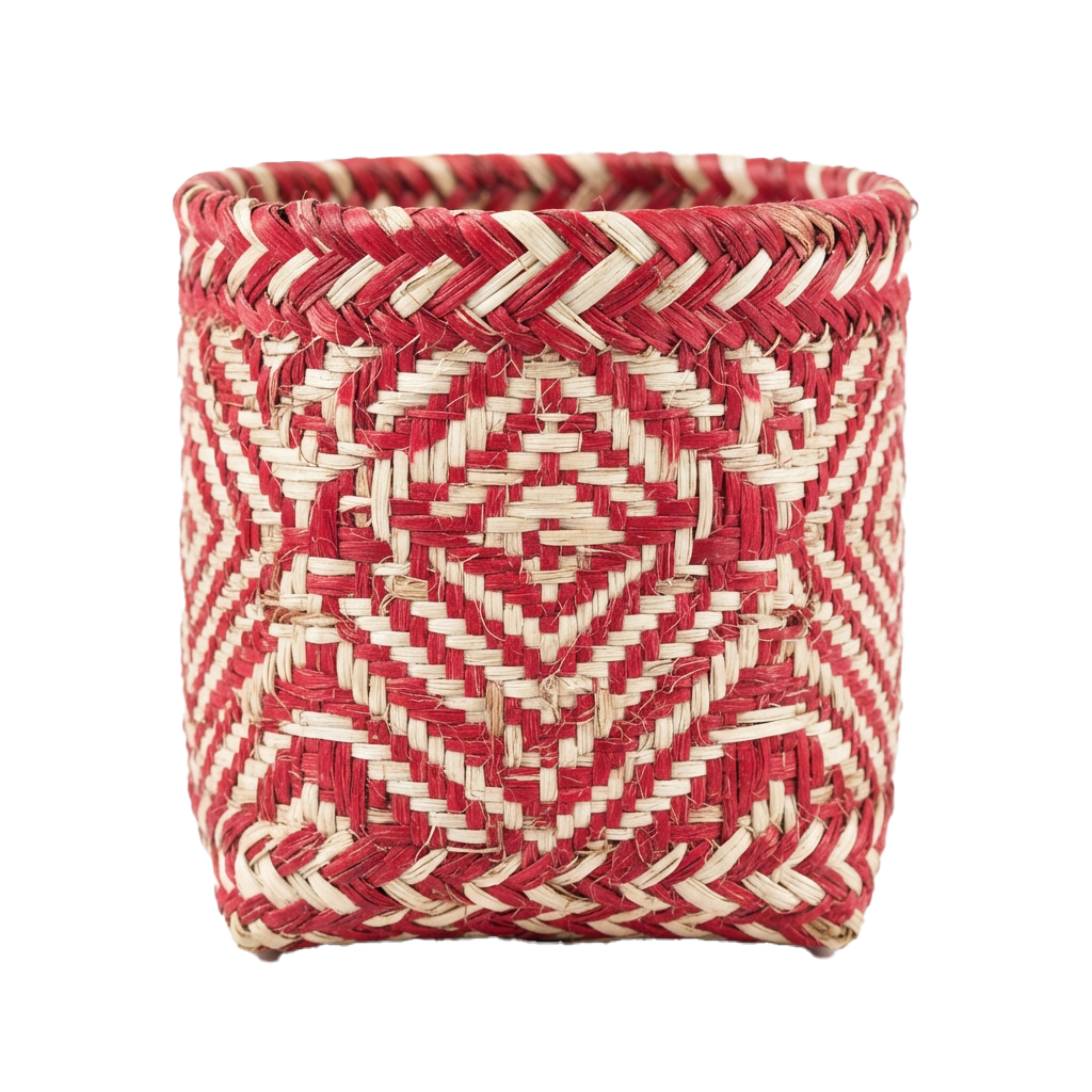 A cylindrical basket with red and cream woven geometric diamond patterns