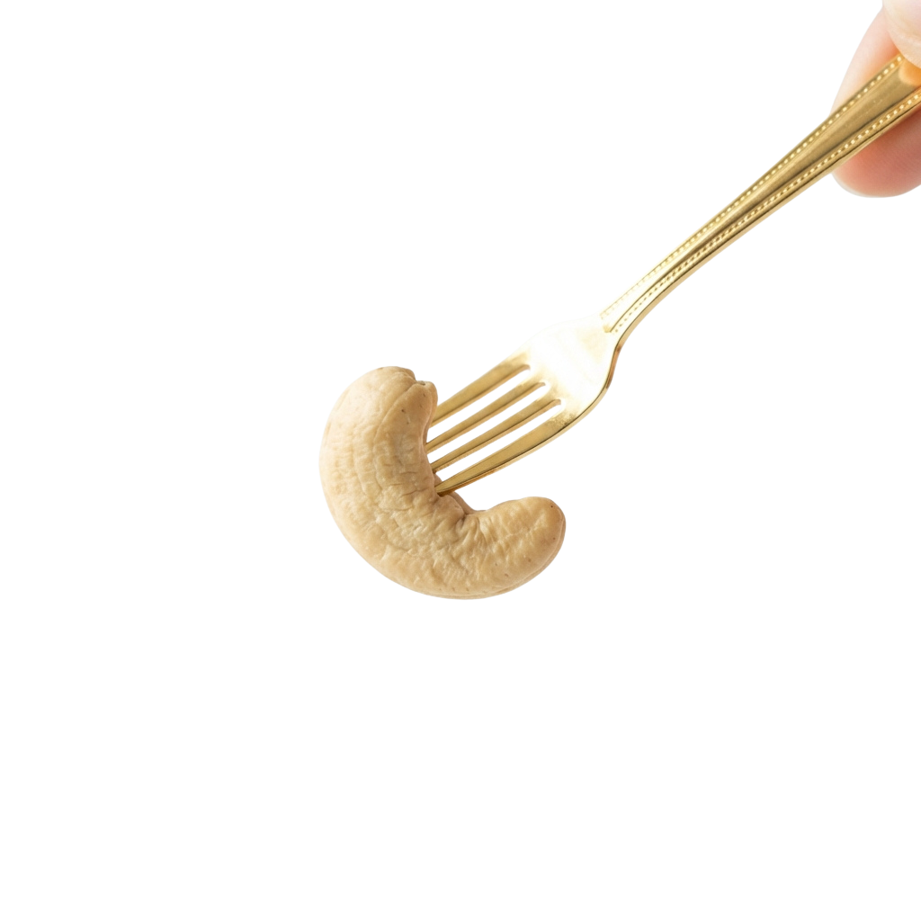 A fork holding a single baked potato wedge against a black background