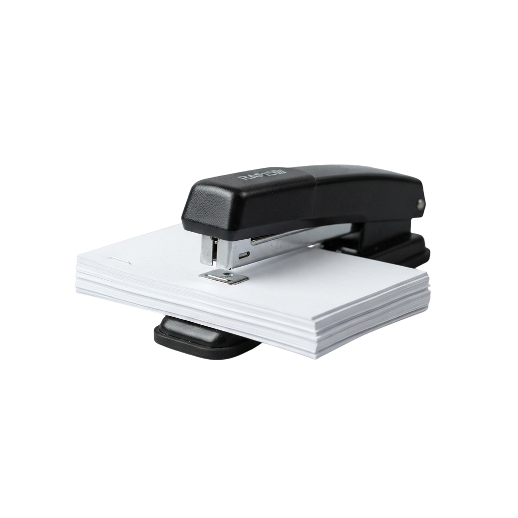Black stapler on a stack of white paper