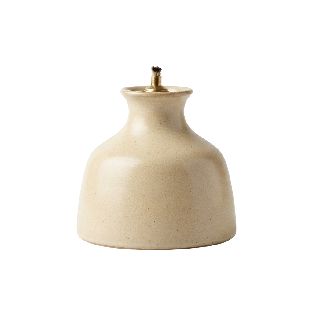 A beige ceramic oil lamp with a small metallic top finial against a black background