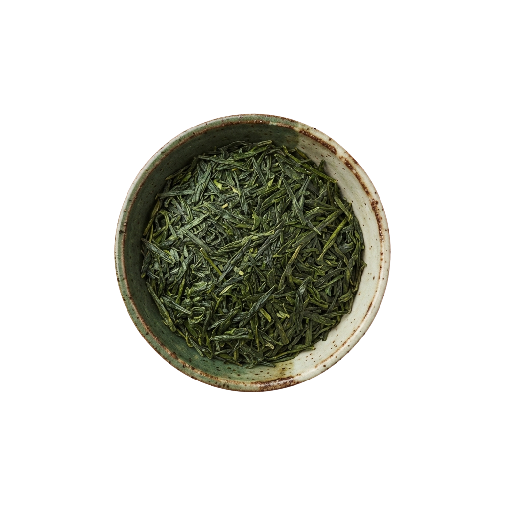 A ceramic bowl filled with green tea leaves ready for steeping