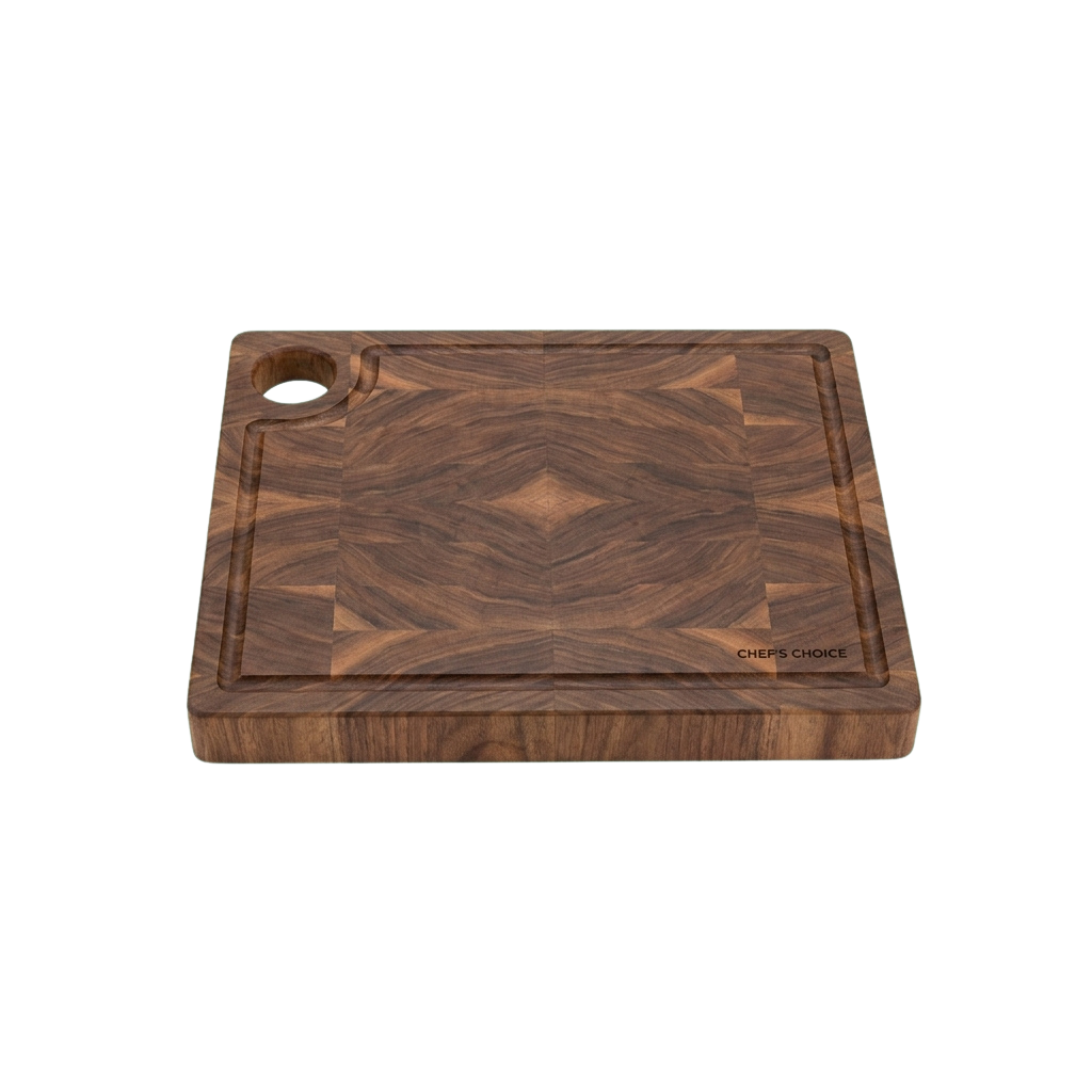 A dark wooden cutting board with a diamond pattern and a juice groove on the left side.