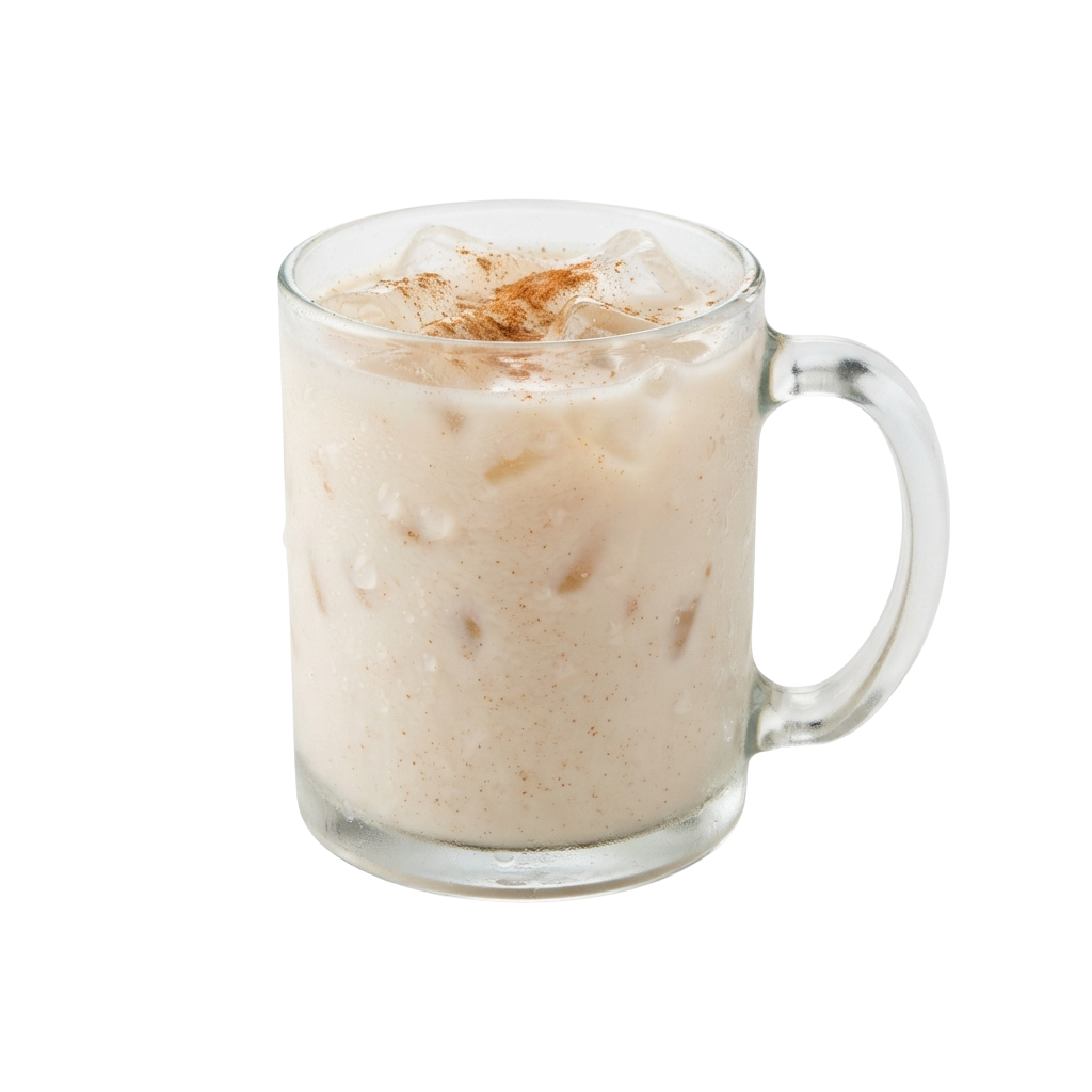 A glass mug filled with an iced caramel-colored drink and ice cubes, topped with caramel drizzle