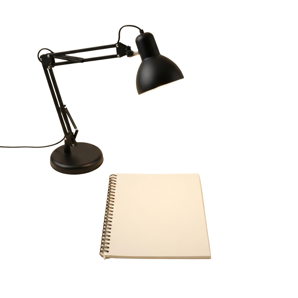 A black adjustable desk lamp positioned next to an open spiral-bound notebook on a dark background