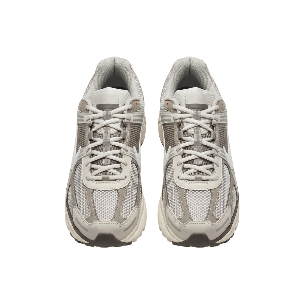 Pair of white and gray running shoes with mesh upper and laces