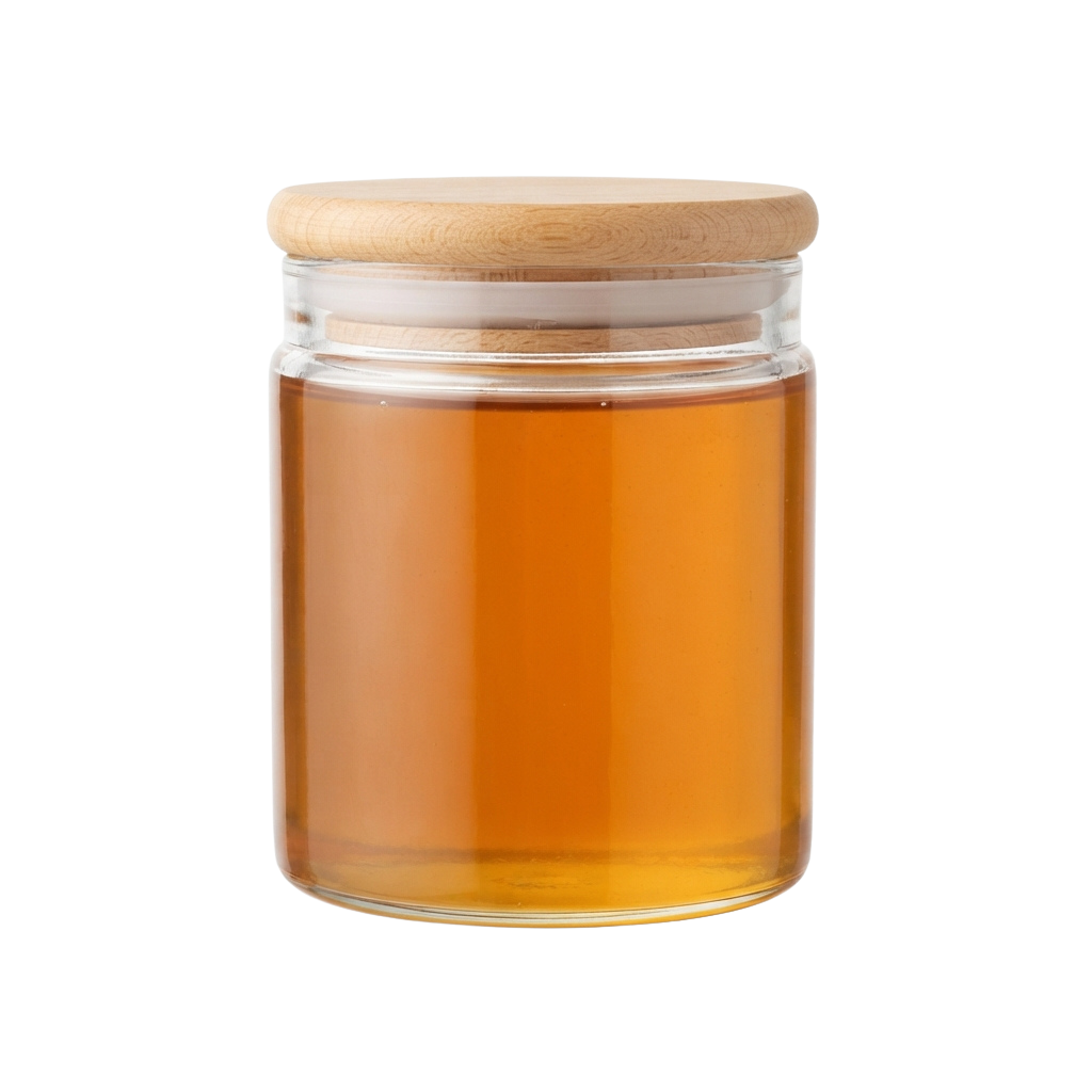 A clear glass jar with amber liquid inside and a wooden lid on top
