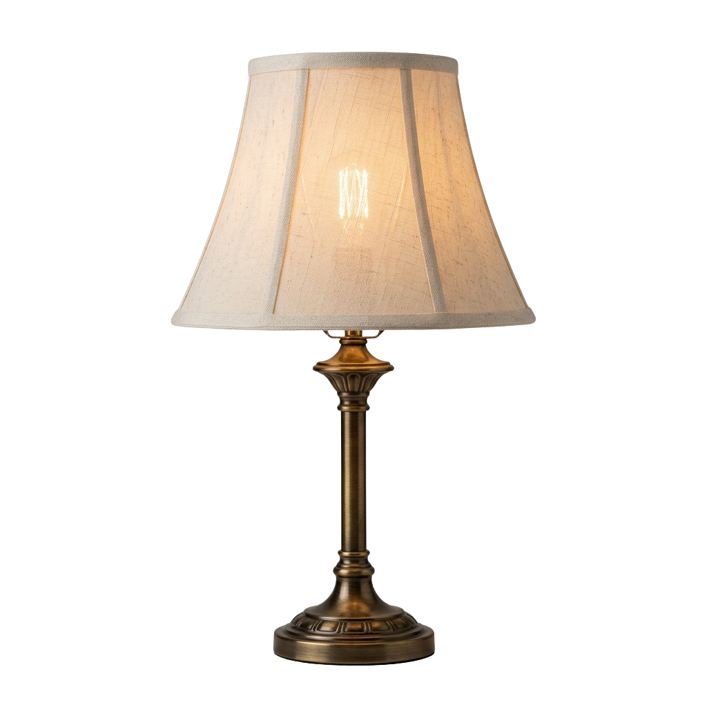 A brass-colored table lamp with a cream-colored lampshade turned on against a dark background