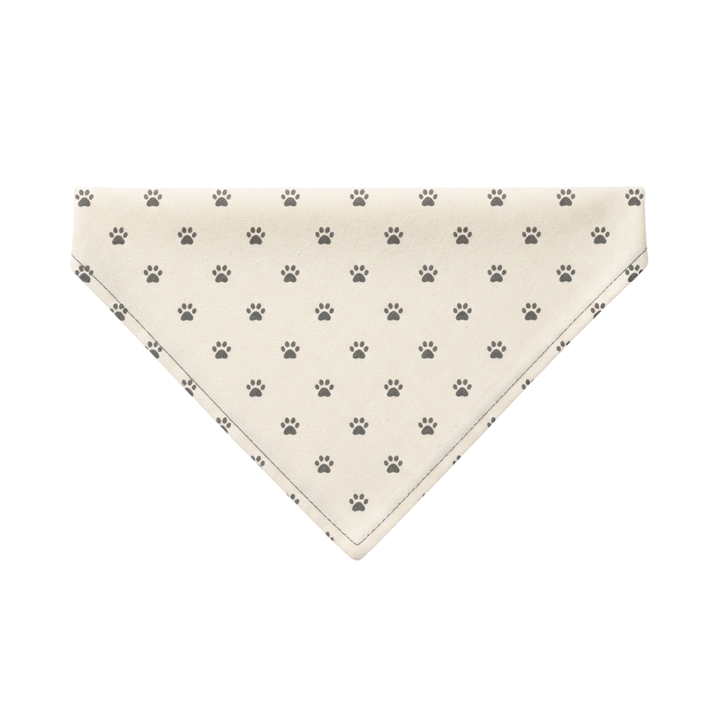 Light-colored triangular bandana with repeated gray paw print pattern