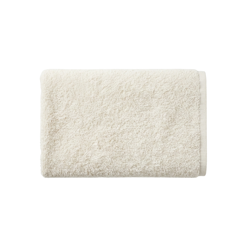 A plush white textured bath mat with a thick, fuzzy surface and trimmed edges.