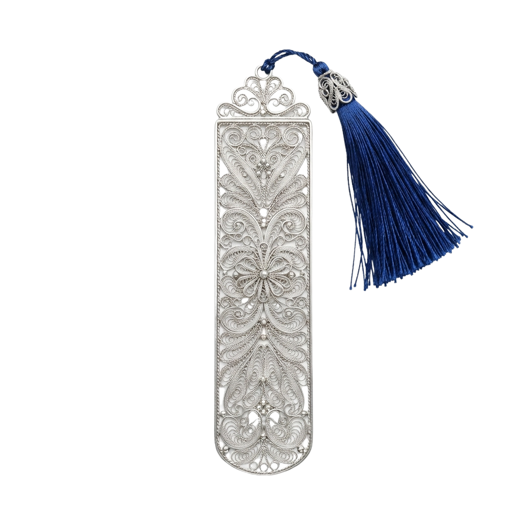 Decorative bookmark with intricate filigree design and a blue tassel attached by a ribbon loop