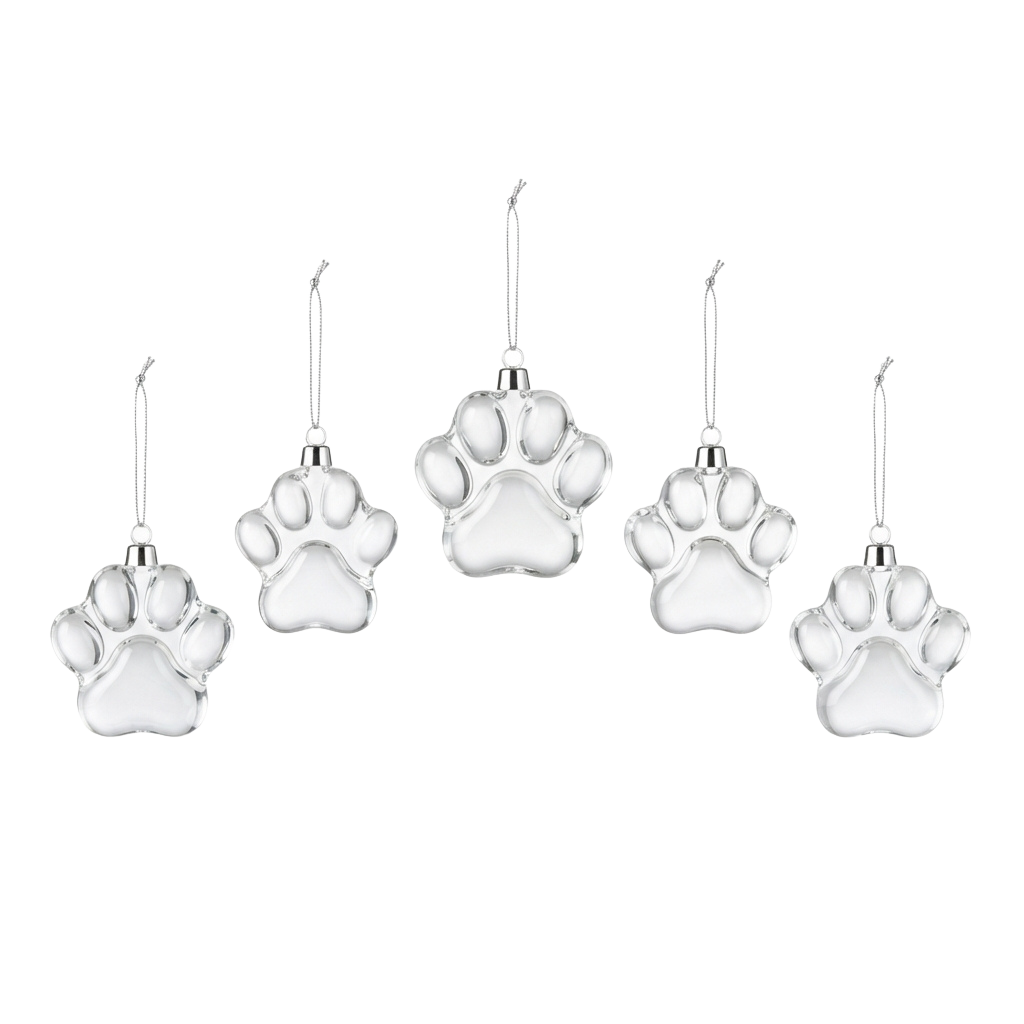 Five white ceramic paw print ornaments hanging on strings against a black background