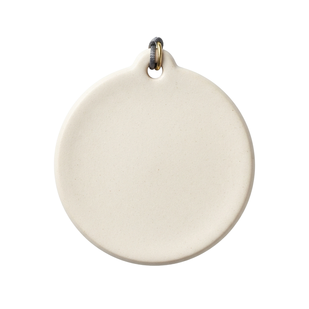 A plain round ceramic pendant hanging on a metallic loop against a black background