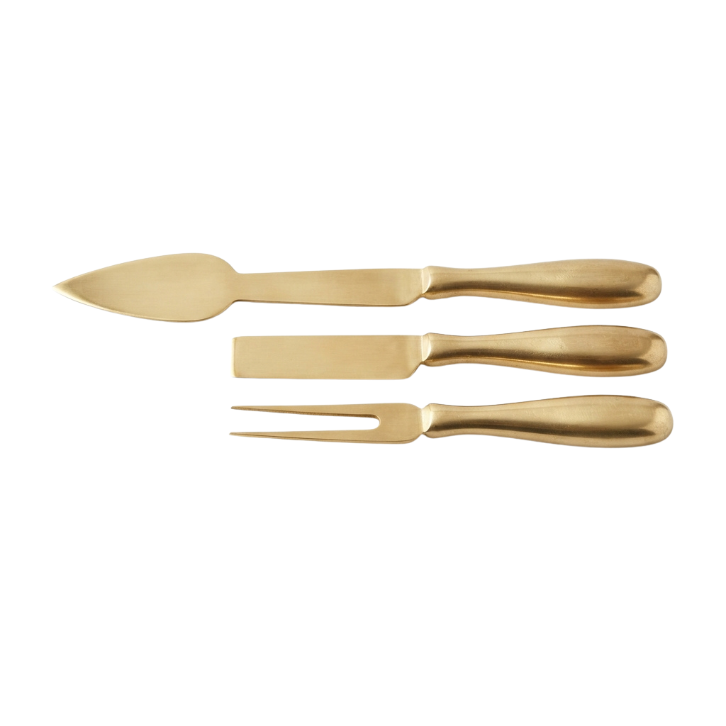 A gold-toned metal spoon, fork, and knife set displayed on a black background