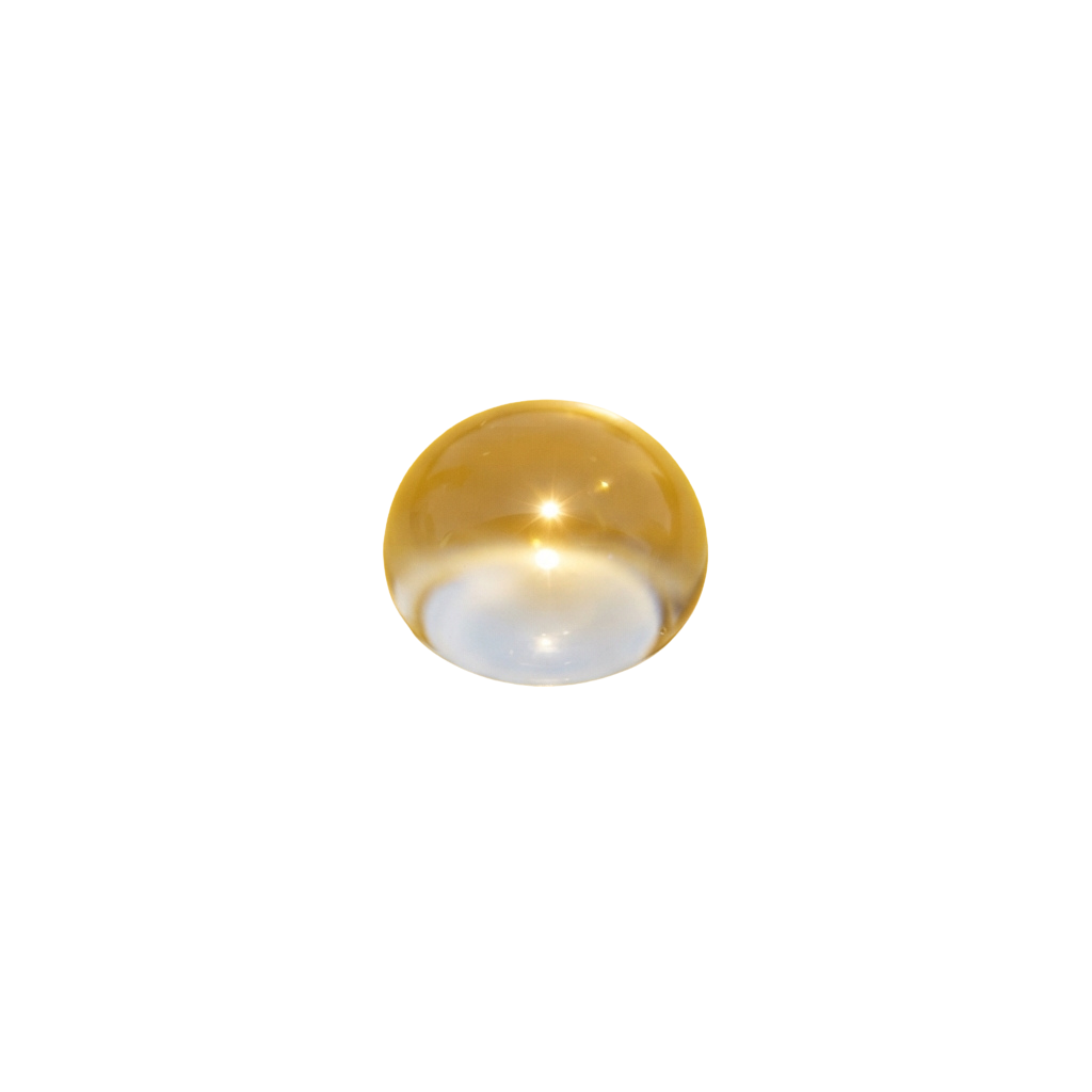 Close-up of a shiny golden spherical object with a reflective surface and bright highlights