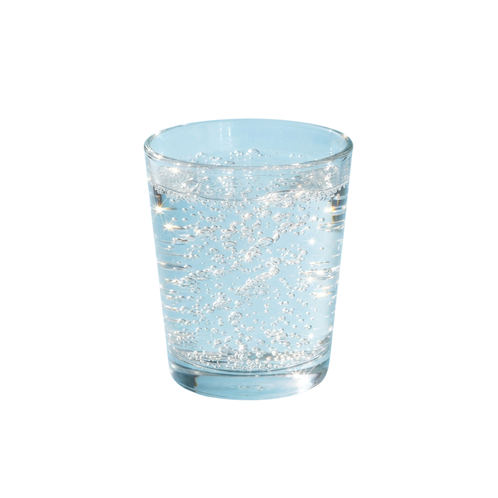 A transparent glass cup filled with sparkling water and bubbles against a dark background