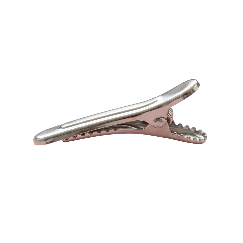 A single rose gold hair clip with a smooth, curved bar and serrated teeth on the claw end.