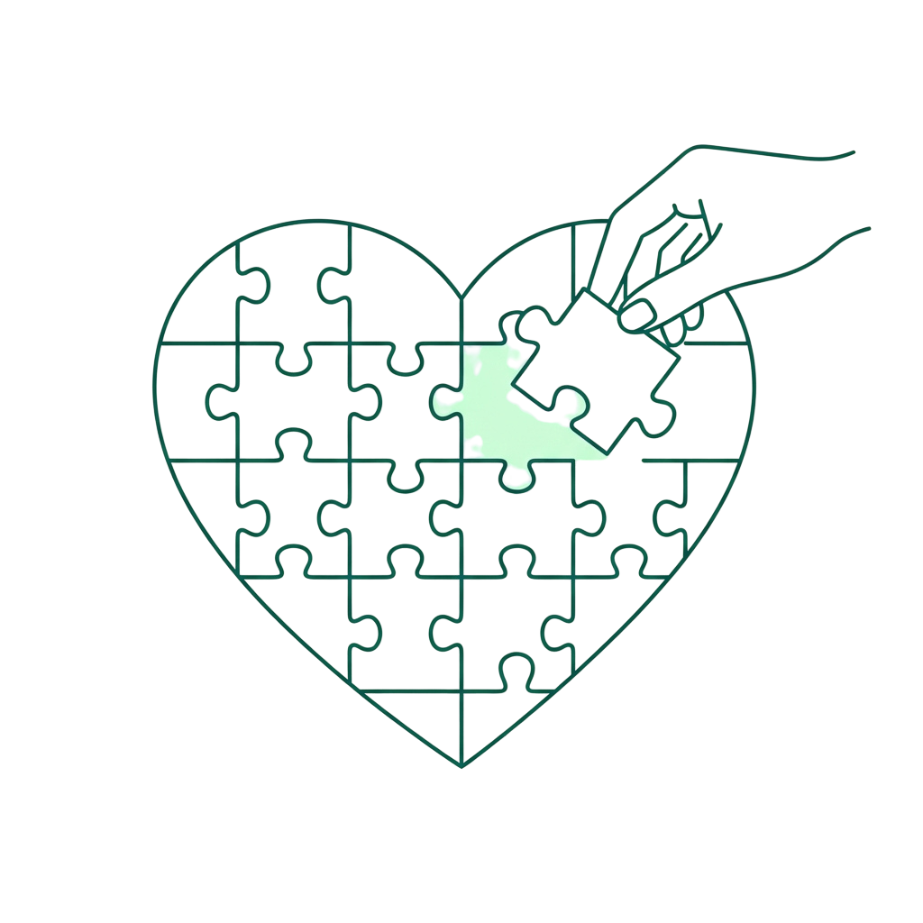 Heart-shaped puzzle with one piece missing and a hand placing it in the correct spot
