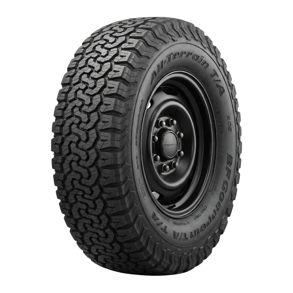 Close-up of an off-road truck tire with deep tread pattern and BigFoot branding visible on the sidewall.
