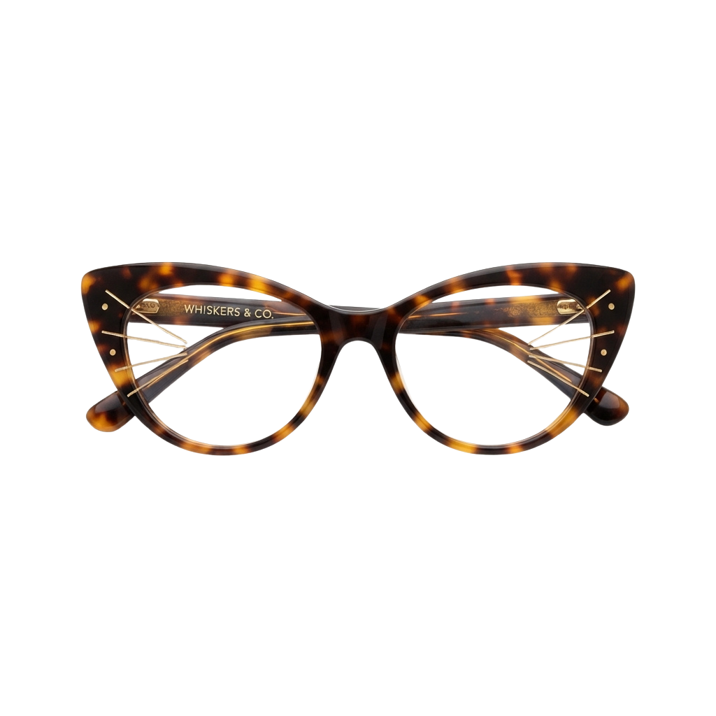 A pair of tortoiseshell cat-eye glasses with gold accents on a black background