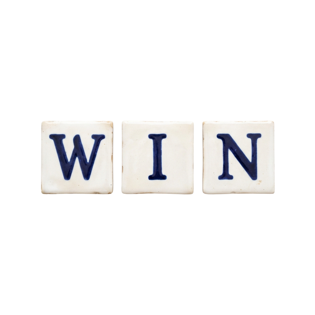 Three white ceramic tiles spelling WIN in blue letters against a black background