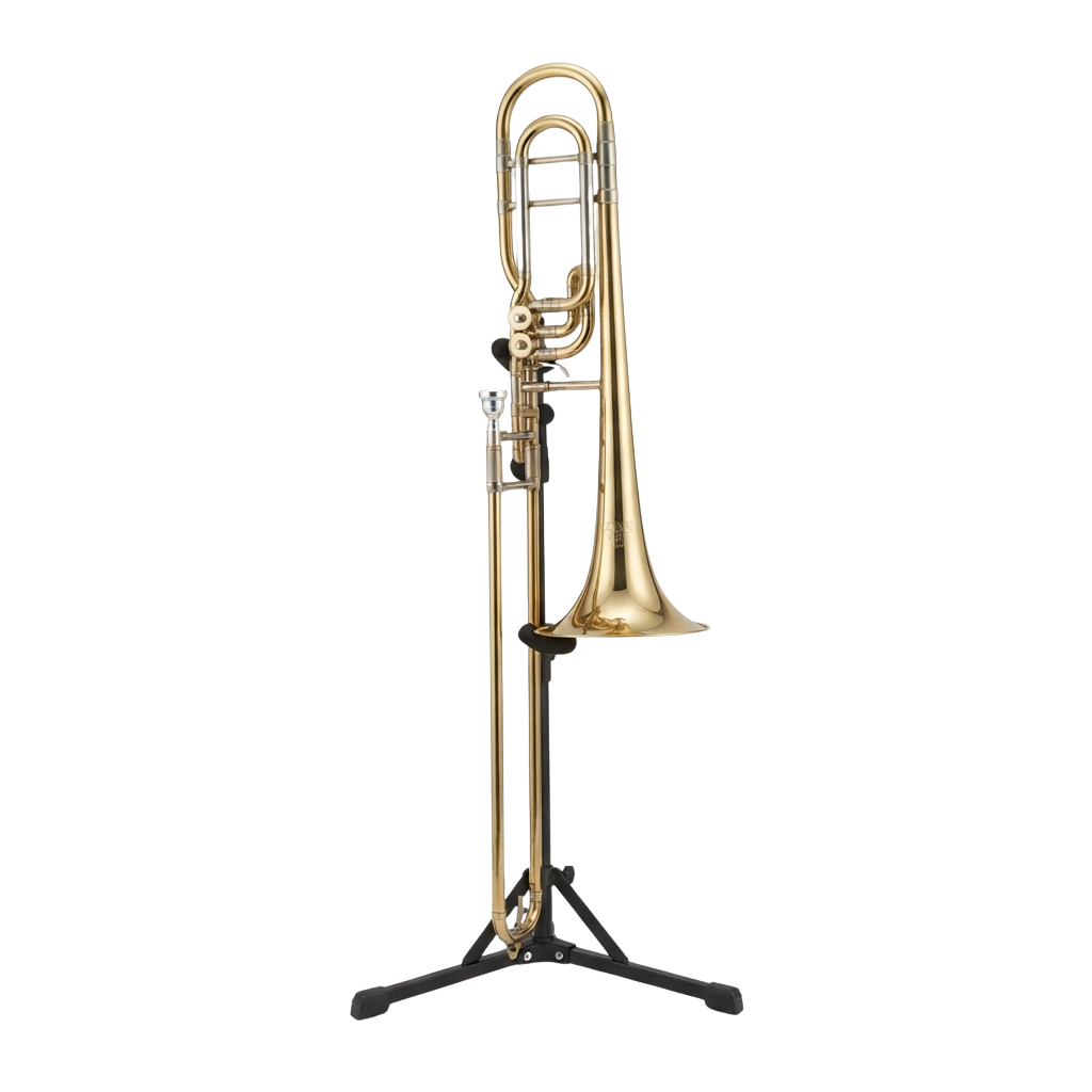 A polished gold trombone on a black stand against a black background
