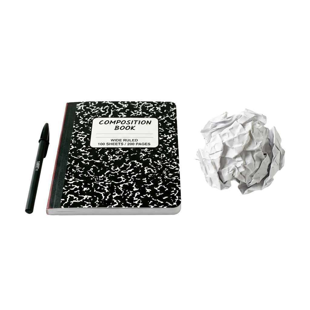 Composition book labeled wide ruled, a pen, and crumpled white paper on a black background
